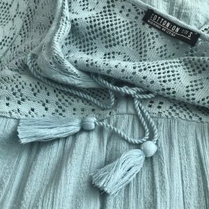 Cinched long sleeve blue teal mid length dress